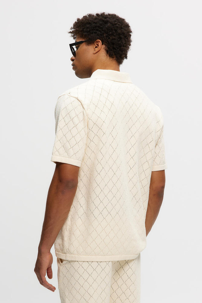 
                  
                    KNITTED POLO - CREAM
                  
                